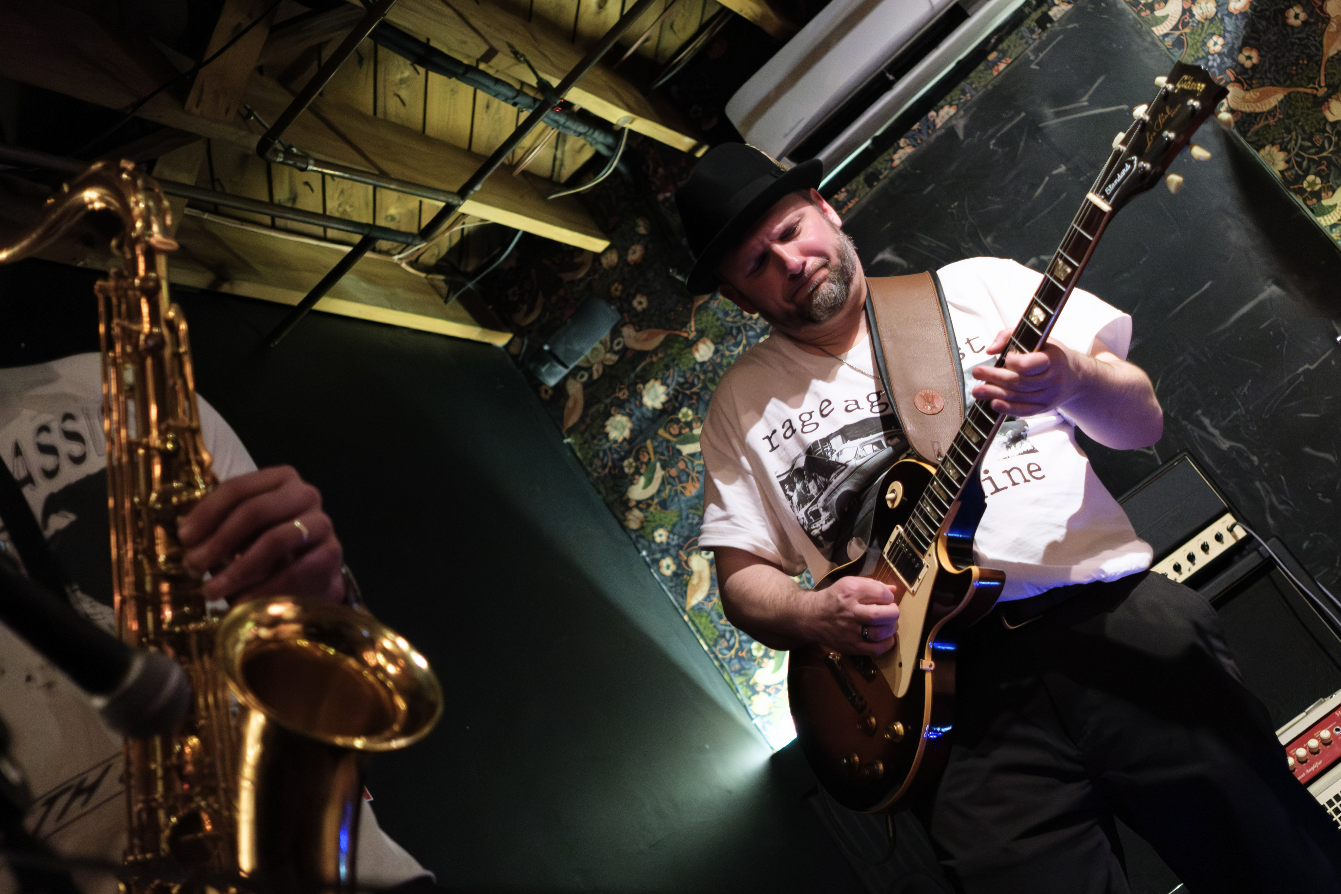 Lead guitarist low angle, dramatic lighting